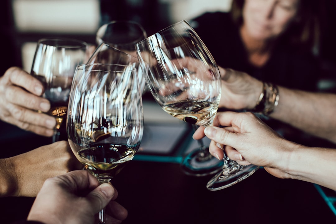Photo by Scott Warman group of people holding footed glasses